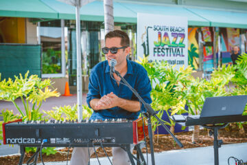 Derek Fairholm talks to the audience during his performance at the Jazz for Tomorrow Stage