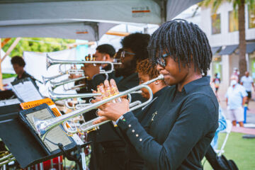 The brass section of the Florida Memorial Jazz Ensemble sharing their sound with the audience